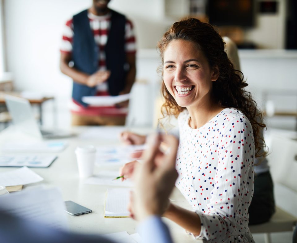 happy-businesswoman-at-meeting-YSNV8BJ.jpg